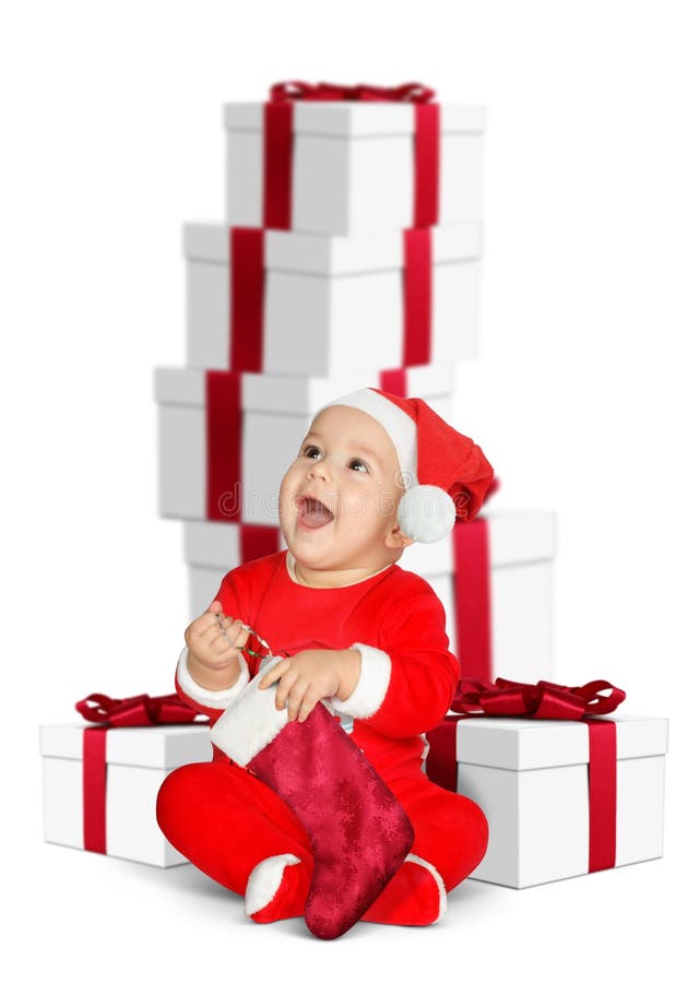 Bebé divertido Santa Claus con los regalos de la Navidad en blanco fotos de archivo libres de regalías Bebé divertido Santa Claus con los regalos de la Navidad en blanco fotos de archivo libres de regalías