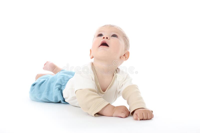 Happy baby on white background looking up, isolated, tummy time. Happy baby on white background looking up, isolated, tummy time