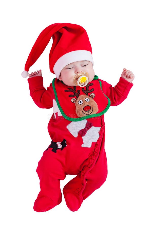 Bebé que duerme o dormido con el pacificador o el onesie simulado, rojo, babero del reno de Rudolph, sombrero de Papá Noel para l foto de archivo Bebé que duerme o dormido con el pacificador o el onesie simulado, rojo, babero del reno de Rudolph, sombrero de Papá Noel para l foto de archivo