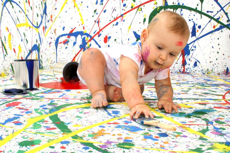 Beautiful baby covered in bright paint. Beautiful baby covered in bright paint