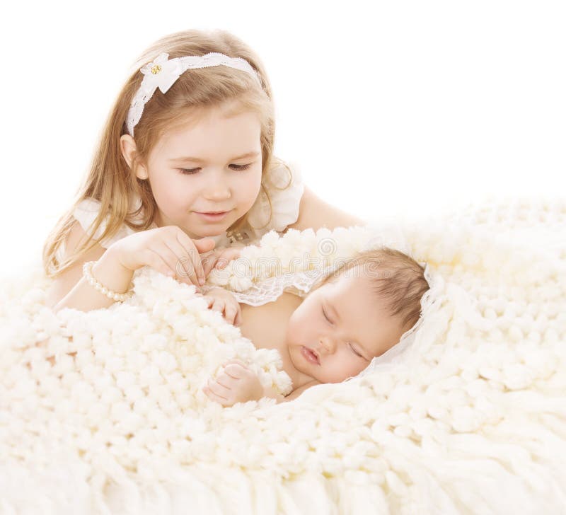 Baby Girl and Newborn Boy, Sister Little Child and Sleeping Brother New Born Kid, Birthday in Family, Love Concept. Baby Girl and Newborn Boy, Sister Little Child and Sleeping Brother New Born Kid, Birthday in Family, Love Concept