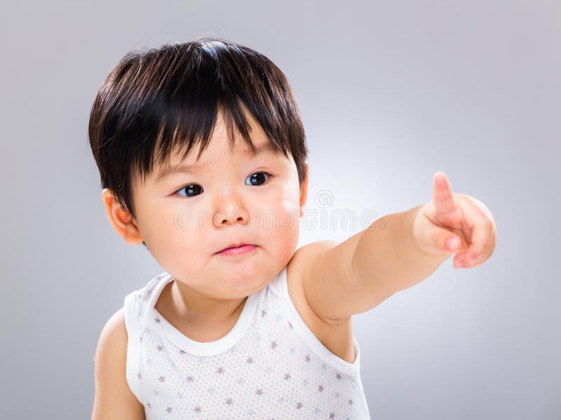 Bebê que aponta o dedo foto de stock Bebê que aponta o dedo foto de stock