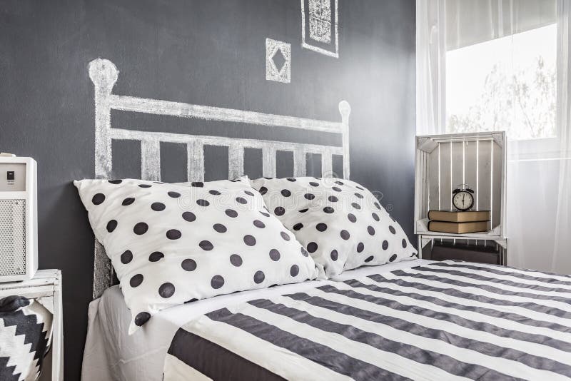 Bed in a Black and White with a Chalkboard Wall Stock Image Image of