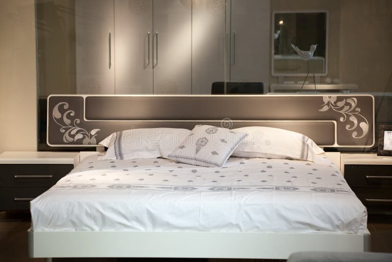 Bed in a luxury room royalty free stock image