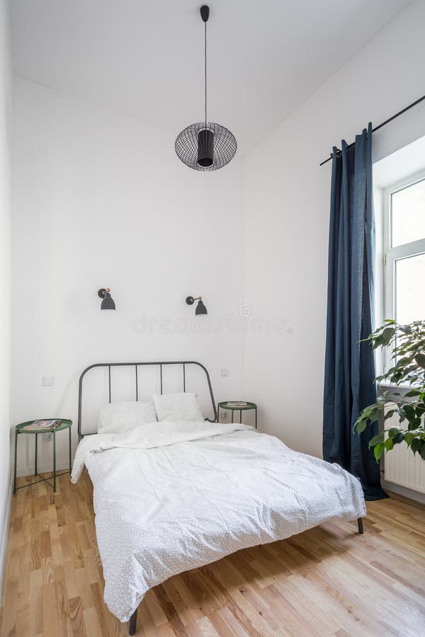 Simple bed with metal headboard stock photos Simple bed with metal headboard stock photos