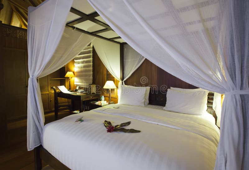 Bed under bed curtains stock photo. Image of comfortable 13036270