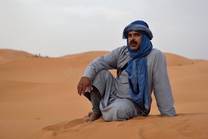 Bedouin Man Wears Traditional Clothing in Sahara Desert Editorial