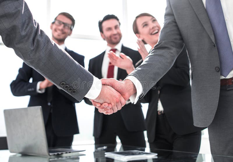Business handshake of business partners after signing the contract.concept of partnership. Business handshake of business partners after signing the contract.concept of partnership