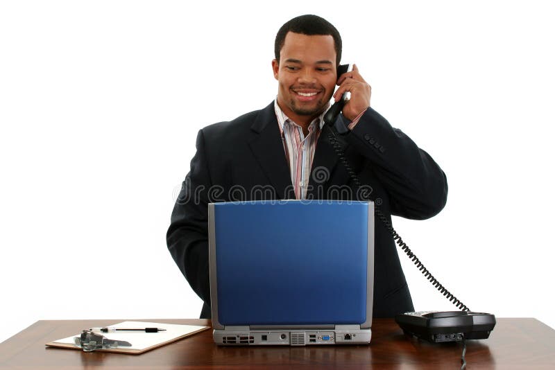 Bedrijfs Mens met Laptop op Telefoon stock afbeelding Bedrijfs Mens met Laptop op Telefoon stock afbeelding