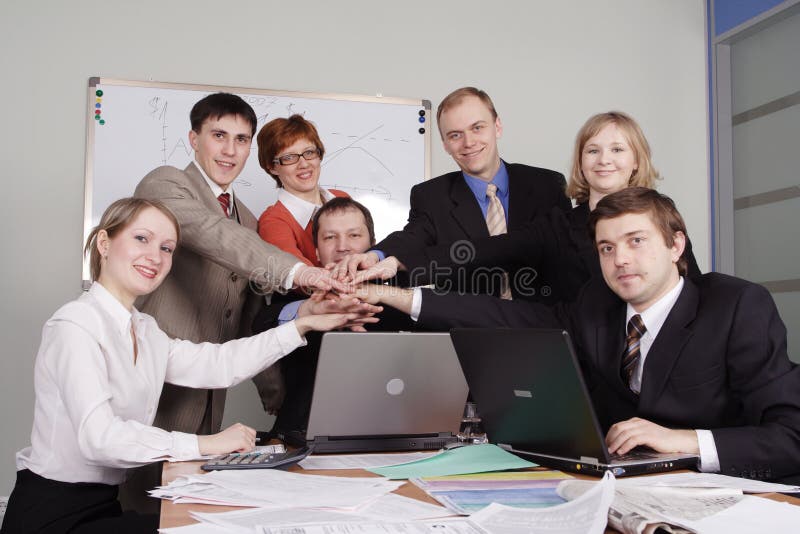 Group of business people working together in the office. Group of business people working together in the office.