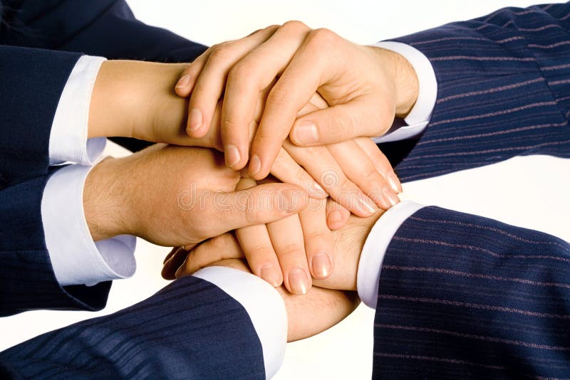 Photo of human hands on top of each other isolated on a white background. Photo of human hands on top of each other isolated on a white background