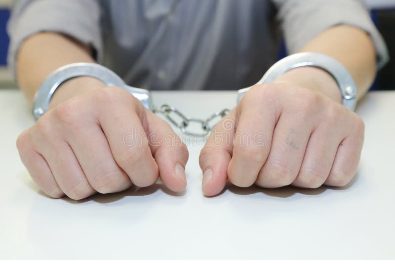 Isolated business man arrested with handcuffs. Isolated business man arrested with handcuffs