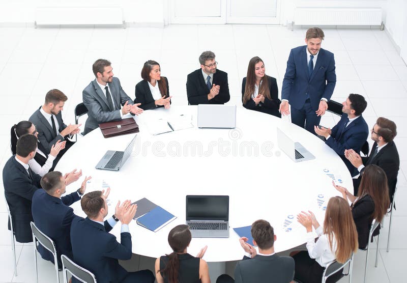 Business people applauding speaker at a business meeting. the concept of partnership. Business people applauding speaker at a business meeting. the concept of partnership
