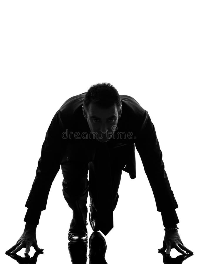 Bedrijfsmensensilhouet op startblok stock fotografie Bedrijfsmensensilhouet op startblok stock fotografie