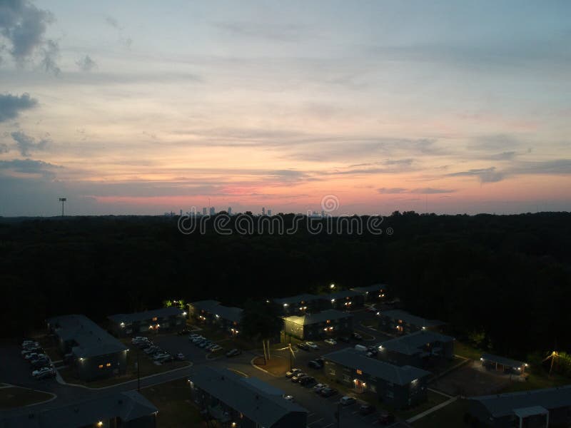 Nestled. Residential complex nestled out-skirts of Atlanta. Springtime brings cotton candy colored sunsets stock image Nestled. Residential complex nestled out-skirts of Atlanta. Springtime brings cotton candy colored sunsets stock image