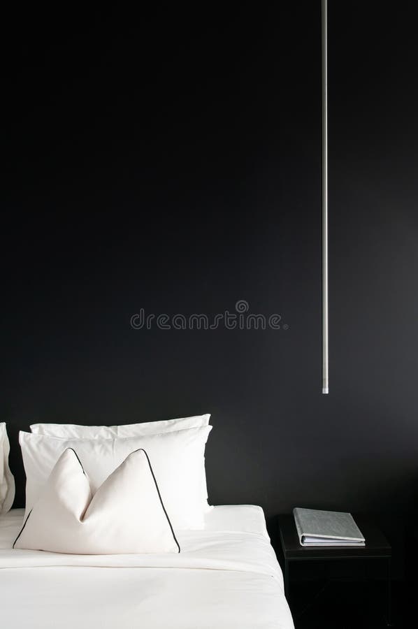 Bedroom with black wall white bed, pillows modern side table, la stock photos Bedroom with black wall white bed, pillows modern side table, la stock photos