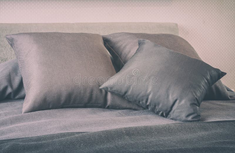 Bedroom with Decorative Grey Pillows on Bed vintage St Stock Photo