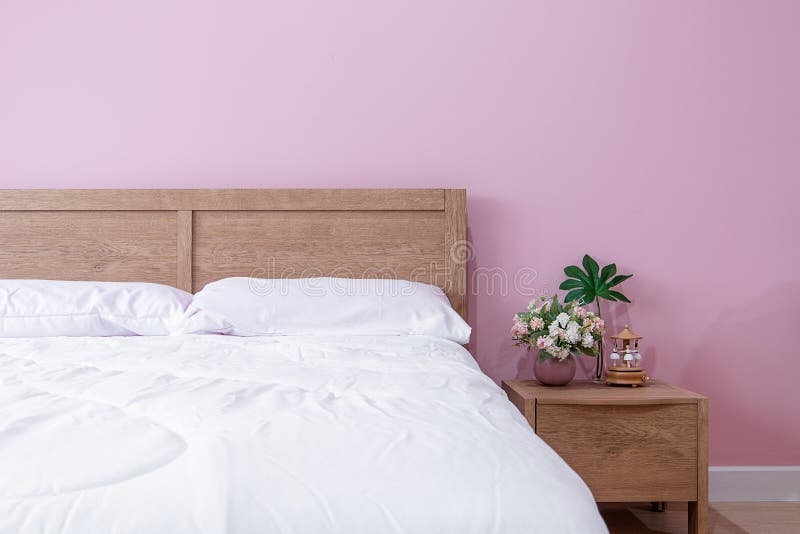Bedroom Interior of Room with Comfortable Bed Near Pink Wall Stock