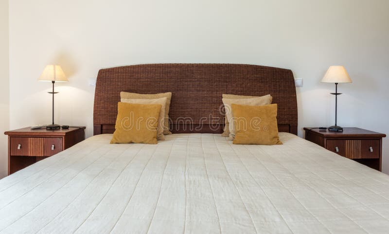 Bedroom in modern style with bed and pillows. Front view. stock image