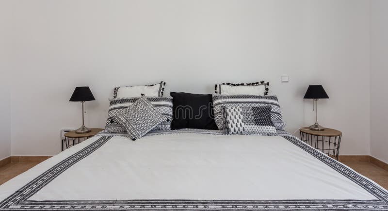 Bedroom in modern style with bed and pillows. Front view. stock images