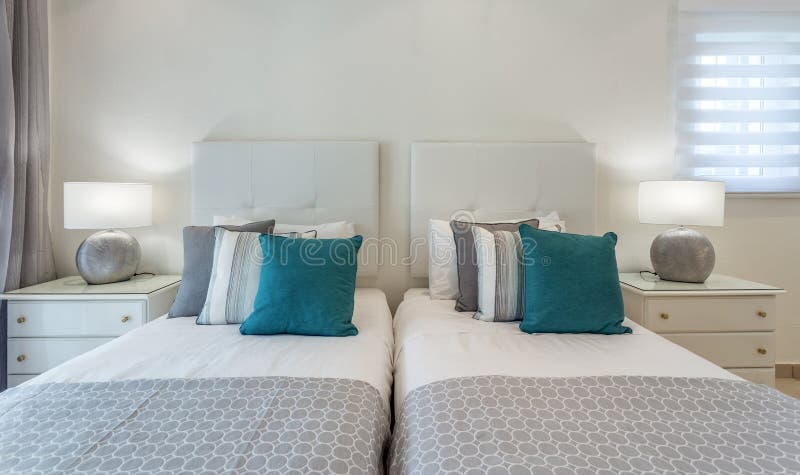 Bedroom in modern style with bed and pillows. Front view. stock photography