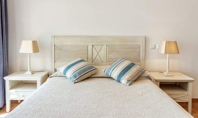 Bedroom in modern style with bed and pillows. Front view. royalty free stock photo