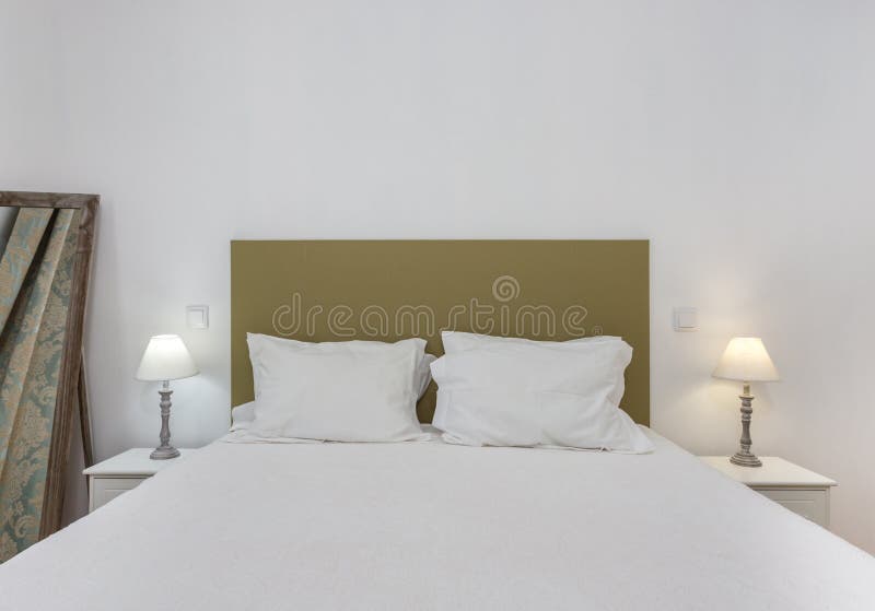 Bedroom in modern style with bed and pillows. Front view. stock image