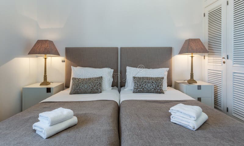 Bedroom in modern style with bed and pillows. Front view. stock photography