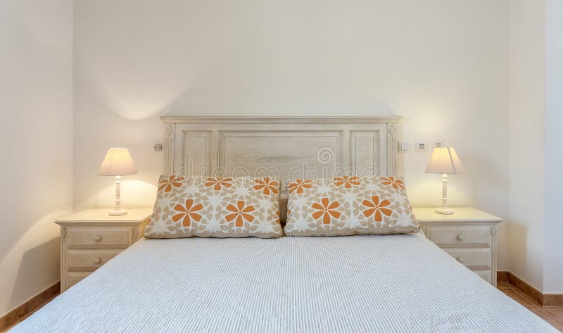 Bedroom in modern style with bed and pillows. Front view. stock image