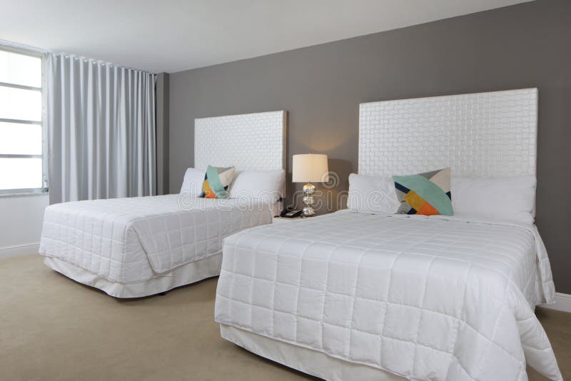 Bedroom with two beds stock photo. Image of condominium 53343456