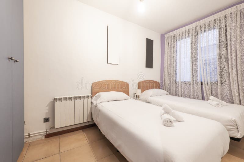 Bedroom with Two Single Beds with Light Wood Headboards, Gray Wardrobe ...