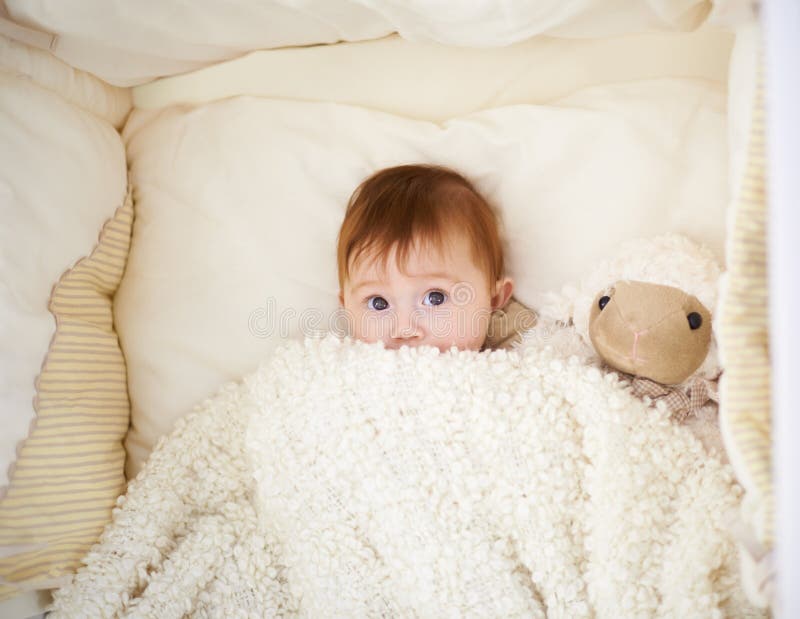 Bedtime for Baby. High Angle Shot of an Adorable Baby in a Cot. Stock