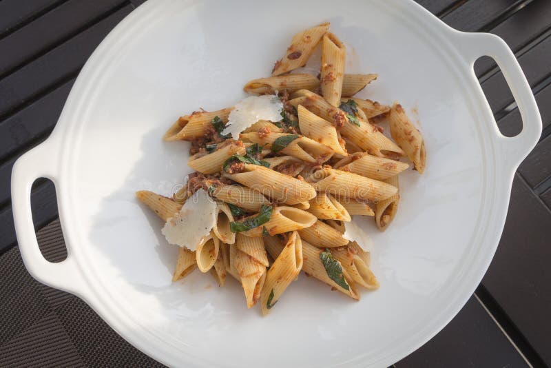 Beef Bolognese Penne with Fresh Basils and Pamesan Cheese Stock Image