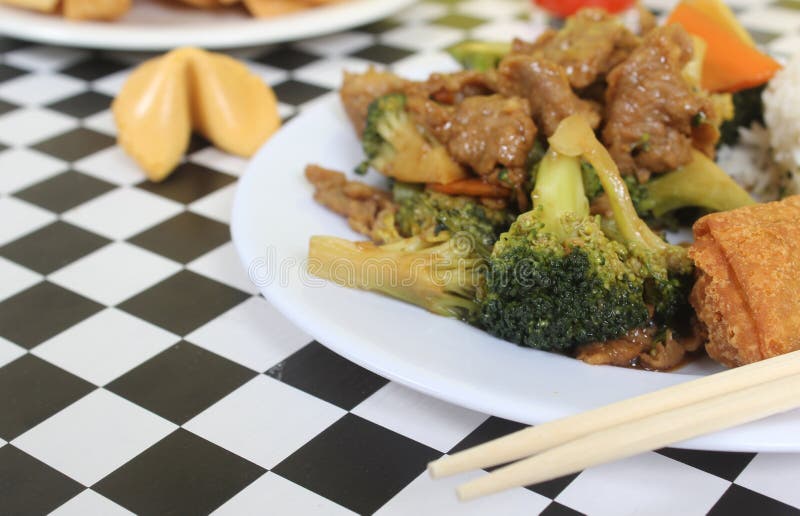 Beef Broccoli and Egg Roll on Plate in Chinese Restaurant Stock Image