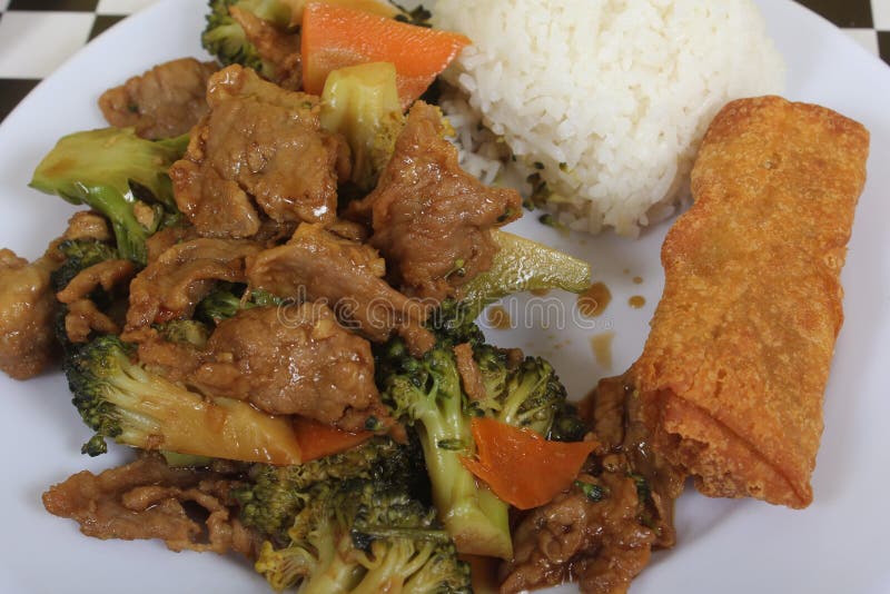 Beef Broccoli and Egg Roll on Plate in Chinese Restaurant Stock Image