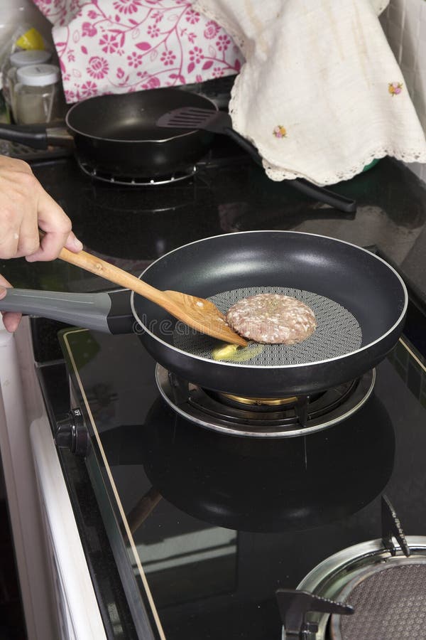 Beef Burger deep fried in the pan royalty free stock photography