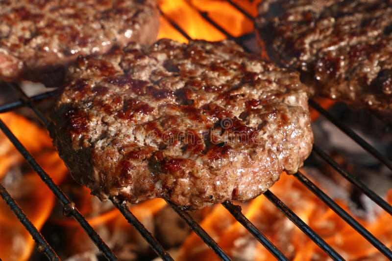 Beef burger for hamburger on barbecue flame grill