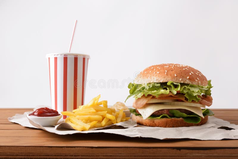 Two Burger with Soda and Chips with Souces on Table Stock Photo Image