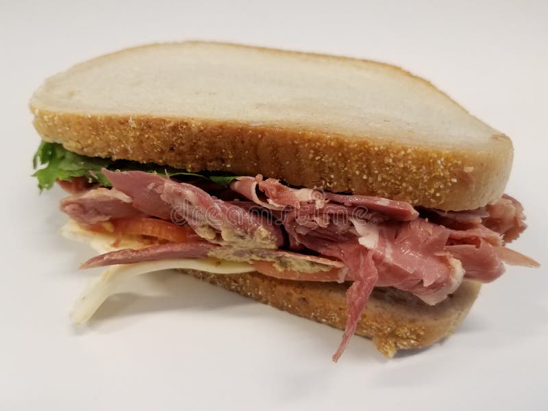 Beef and Cheese Sandwich with Mustard Sauce on White Desk Stock Image