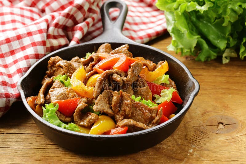 Beef Fajitas with colorful bell peppers in pan