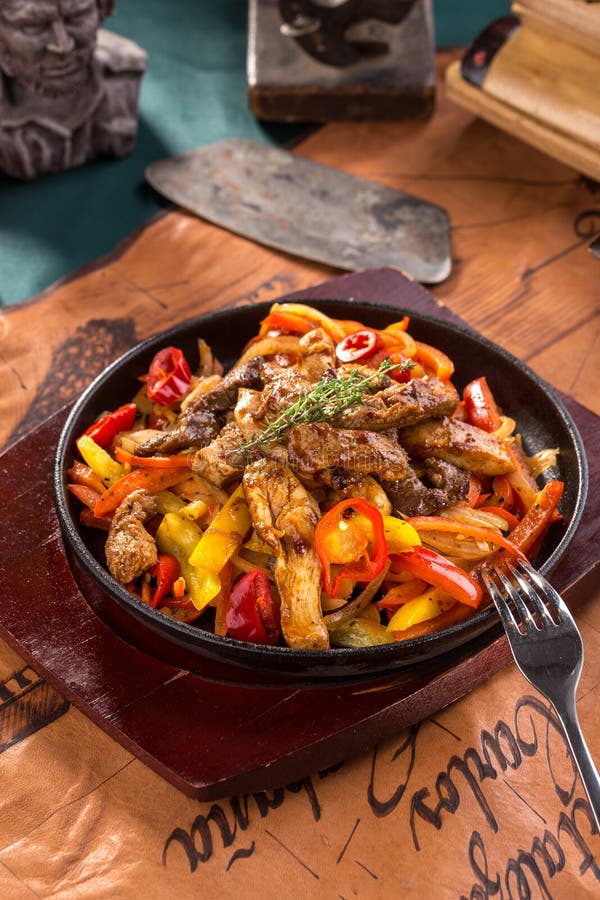 Beef Fajitas with Colorful Vegetables in Pan Isolated on White
