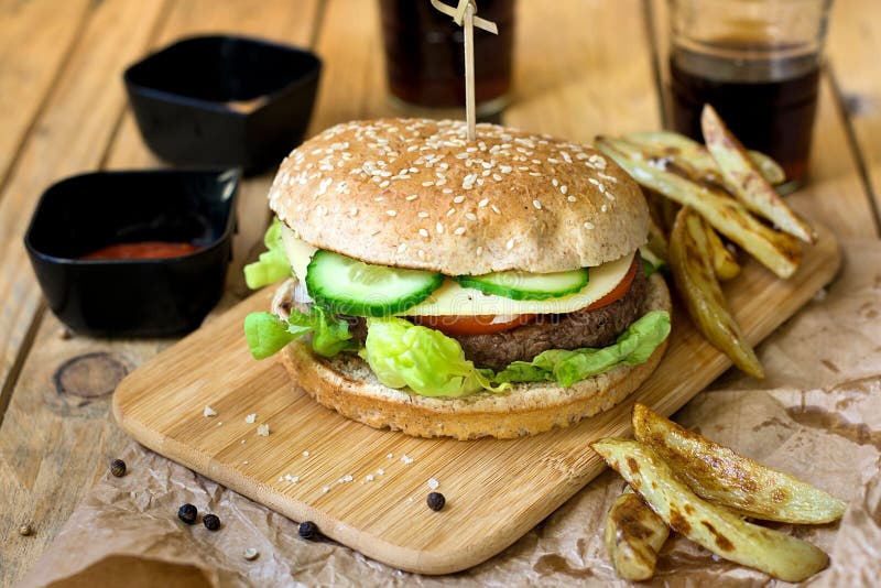 Beef Hamburger With Whole Wheat Bun And French Fries Stock Image