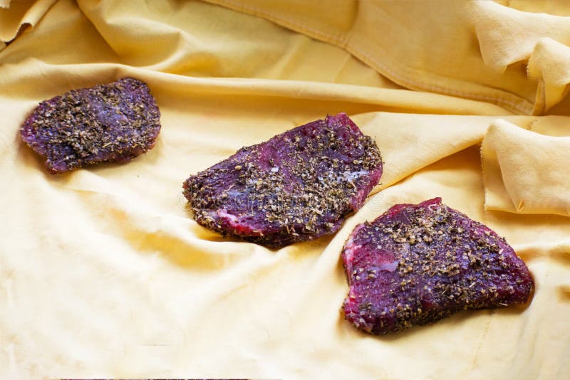 Beef Jerky and Spice on the Table. Dried Peppered Beef Jerky Cut in