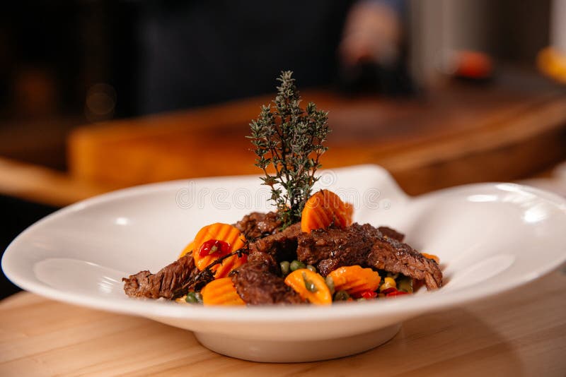 Beef Meal Presentation on White Plate. Chef Specialty Dish Stock Image