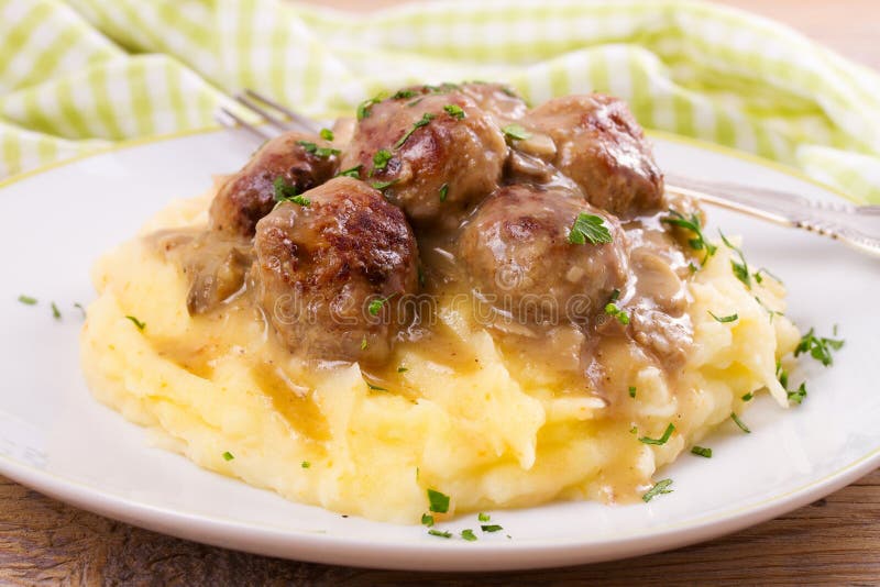 Beef Meatballs with Mushroom Gravy on Mashed Potato. Stock Image