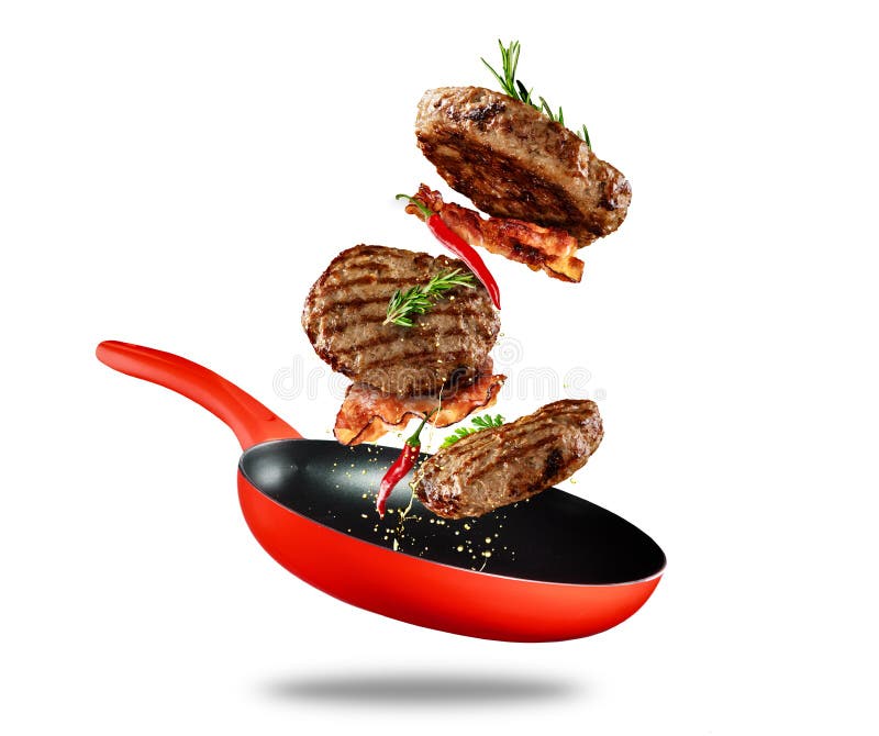 Beef milled meat flying from a pan on white background