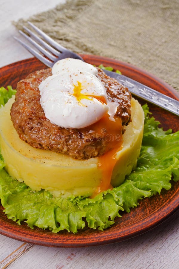 Beef and Pork Patty with Poached Egg, Smashed Potato and Lettuce Stock Photo Image of cuisine
