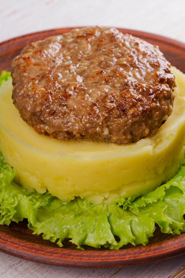 Beef and Pork Patty with Smashed Potato and Lettuce Stock Photo Image