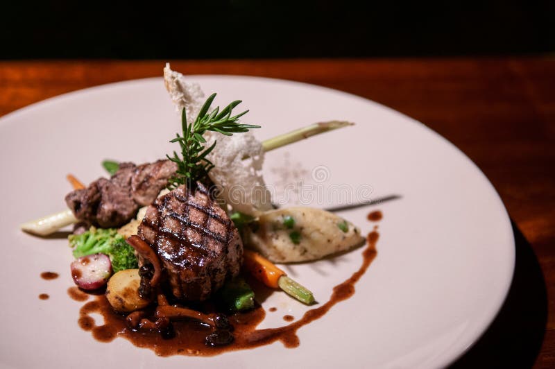 Beef sirloin steak with red wine gravy mushroom, vegetable and roasted potato stock images Beef sirloin steak with red wine gravy mushroom, vegetable and roasted potato stock images