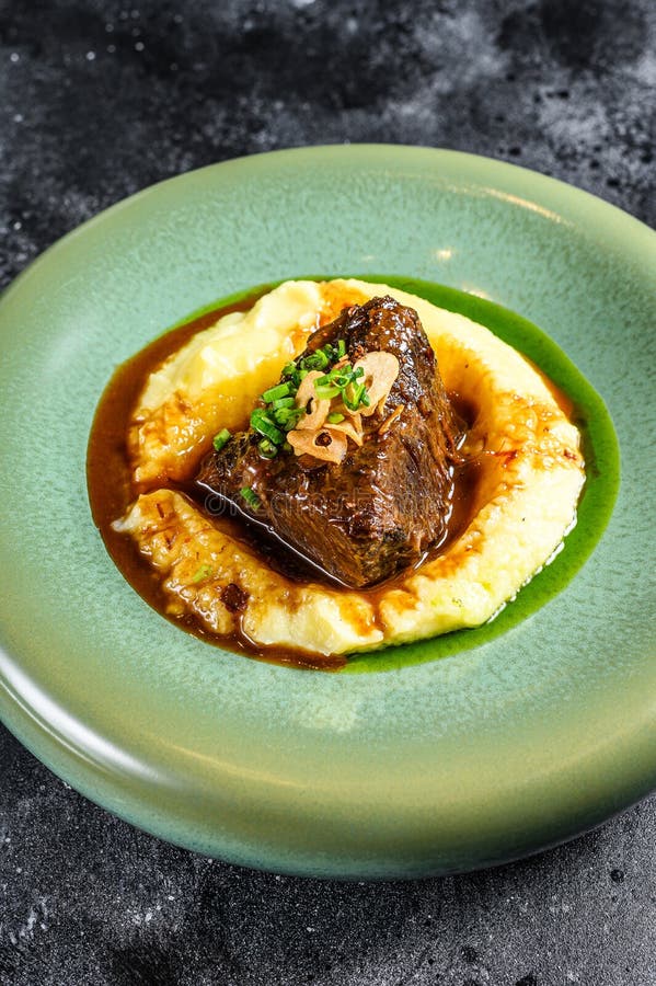 Beef Sirloin Steak With A Side Dish Of Mashed Potatoes. Black